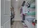 Walk-in closet with clothes hanging, shoe rack, and ample storage space at 1051 Margate Dr, Greenwood, IN 46143