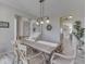 This dining area features a wood table and seating, illuminated by a pendant light at 1051 Margate Dr, Greenwood, IN 46143