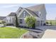 Stylish two-story home boasting a three-car garage, well-maintained landscaping, and a concrete driveway at 1051 Margate Dr, Greenwood, IN 46143