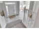 Bright foyer showcasing wood flooring, a white door, and access to the living space at 1051 Margate Dr, Greenwood, IN 46143