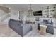 Bright living room featuring two sofas, a wood coffee table, and custom built-in shelving at 1051 Margate Dr, Greenwood, IN 46143