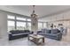 Spacious living room showcases comfortable seating and ample natural light from large windows at 1051 Margate Dr, Greenwood, IN 46143