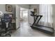 Home office featuring a treadmill, desk, and natural lighting, promoting a comfortable and productive workspace at 1051 Margate Dr, Greenwood, IN 46143