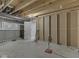 Unfinished basement with exposed ceiling and concrete walls, ready for your custom design at 1051 Margate Dr, Greenwood, IN 46143