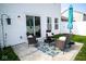 Back patio with outdoor seating and a sliding glass door for easy indoor-outdoor living at 10538 Rose Mill Dr, Lawrence, IN 46235