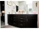 Elegant bathroom featuring a double vanity, framed mirrors and neutral wall decor at 10538 Rose Mill Dr, Lawrence, IN 46235