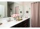 Elegant bathroom vanity with double sinks, quartz countertop, and sleek hardware for a modern aesthetic at 10538 Rose Mill Dr, Lawrence, IN 46235
