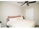 Inviting bedroom featuring a comfy bed, neutral tones and closet doors at 10538 Rose Mill Dr, Lawrence, IN 46235