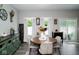 Cozy dining area with a round table, neutral decor, and plenty of natural light at 10538 Rose Mill Dr, Lawrence, IN 46235