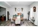 Cozy dining room featuring a round wood table, comfortable seating, and stylish decor elements for a welcoming atmosphere at 10538 Rose Mill Dr, Lawrence, IN 46235