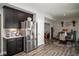 Open concept kitchen and dining area with stainless steel fridge and cozy dining space with modern accents at 10538 Rose Mill Dr, Lawrence, IN 46235