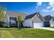 Attractive single-Gathering home with a brick and siding exterior and a well-maintained lawn at 10538 Rose Mill Dr, Lawrence, IN 46235