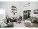 Bright living room featuring modern decor, high ceilings, and stylish furnishings at 10538 Rose Mill Dr, Lawrence, IN 46235