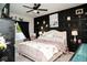 Charming main bedroom featuring a comfortable bed, stylish decor, and ambient lighting for a relaxing retreat at 10538 Rose Mill Dr, Lawrence, IN 46235