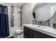 Bathroom featuring a modern vanity with sink, updated fixtures, and stylish tile in the shower at 106 W Delaware St, Fortville, IN 46040