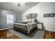 Stylish primary bedroom featuring neutral tones, decorative accents, and a large window at 106 W Delaware St, Fortville, IN 46040