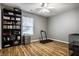 This flexible room has wood floors and a sunny window; use as a bedroom, office, or workout space at 106 W Delaware St, Fortville, IN 46040