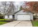Charming single-story home with a well-maintained front yard and attached two-car garage at 106 W Delaware St, Fortville, IN 46040