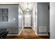 Bright foyer with tile flooring, leading to an open living space, adorned with decorative wall art at 106 W Delaware St, Fortville, IN 46040