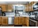 Well-lit kitchen featuring stainless steel appliances, ample counter space, and plenty of wooden cabinetry at 106 W Delaware St, Fortville, IN 46040