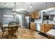 Eat-in kitchen with tile floor, stainless appliances, and view to the dining room at 106 W Delaware St, Fortville, IN 46040