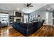 Spacious living room featuring a stone fireplace, hardwood floors, and ample natural light at 106 W Delaware St, Fortville, IN 46040