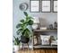 Stylish shelving in the living room, adorned with decorative accents, plants and a small table lamp at 106 W Delaware St, Fortville, IN 46040