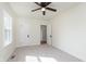 Bedroom with new carpeting and an adjacent door with an additional double-hung window at 10745 Southeastern Ave, Indianapolis, IN 46239
