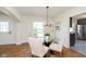 Elegant dining room with a glass-top table, stylish chairs, and modern lighting at 10745 Southeastern Ave, Indianapolis, IN 46239