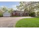 Charming single-story brick home with a detached garage and a well-maintained front yard at 10745 Southeastern Ave, Indianapolis, IN 46239
