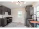 Updated kitchen with stainless appliances, modern fixtures, and stylish gray cabinetry at 10745 Southeastern Ave, Indianapolis, IN 46239