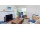 Cozy living room with fireplace, stylish furnishings, and ample natural light at 10745 Southeastern Ave, Indianapolis, IN 46239