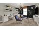 Comfortable bonus room featuring built-in shelves, desks, and comfortable seating at 10805 Soda Creek Ct, Indianapolis, IN 46239