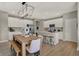 Charming kitchen with modern white cabinets, stainless steel appliances and island with seating at 10805 Soda Creek Ct, Indianapolis, IN 46239
