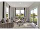 Bright and airy living room featuring views of the lake and lots of natural light at 10805 Soda Creek Ct, Indianapolis, IN 46239