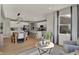 Well-lit living room featuring hardwood floors, modern furniture, and an open concept to the kitchen at 10805 Soda Creek Ct, Indianapolis, IN 46239