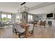 Bright open concept living space including dining area and living room with a fireplace at 10805 Soda Creek Ct, Indianapolis, IN 46239
