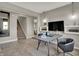 Modern home office space with stylish desk, chairs, shelving, and contemporary lighting fixtures at 10805 Soda Creek Ct, Indianapolis, IN 46239