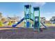 Colorful community playground with slides and climbing features, set in a suburban neighborhood with clear blue skies at 1087 Stubble Run, Danville, IN 46122