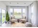 Sunroom with windows, comfortable seating, and view of backyard at 1087 Stubble Run, Danville, IN 46122