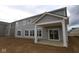 New construction home featuring a patio and neutral siding with white trim and multiple windows at 12417 Fresh Stock Dr, Noblesville, IN 46060