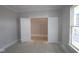 Bedroom with open double doors to the walk-in closet and large windows at 12417 Fresh Stock Dr, Noblesville, IN 46060