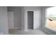 Bedroom with gray walls, carpeted floors, a window and a closet with sliding doors at 12417 Fresh Stock Dr, Noblesville, IN 46060