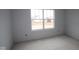 Bright bedroom with a large window, offering a serene space ready for customization and comfort at 12417 Fresh Stock Dr, Noblesville, IN 46060