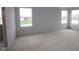 A well-lit, unfinished bedroom with three windows offering great natural light and customization options at 12417 Fresh Stock Dr, Noblesville, IN 46060