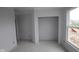 Unfinished bedroom features neutral walls, a closet and a window to provide natural light at 12417 Fresh Stock Dr, Noblesville, IN 46060