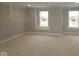 Open living room featuring two large windows for great natural light at 12417 Fresh Stock Dr, Noblesville, IN 46060