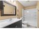 Well-lit bathroom featuring a dual sink vanity and a combined tub and shower at 12449 Huntington Dr, Indianapolis, IN 46229
