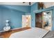 Bedroom with blue accent wall and ceiling fan at 12449 Huntington Dr, Indianapolis, IN 46229