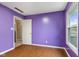 Bright bedroom with hardwood floors and a view of the outdoors from the window at 12449 Huntington Dr, Indianapolis, IN 46229